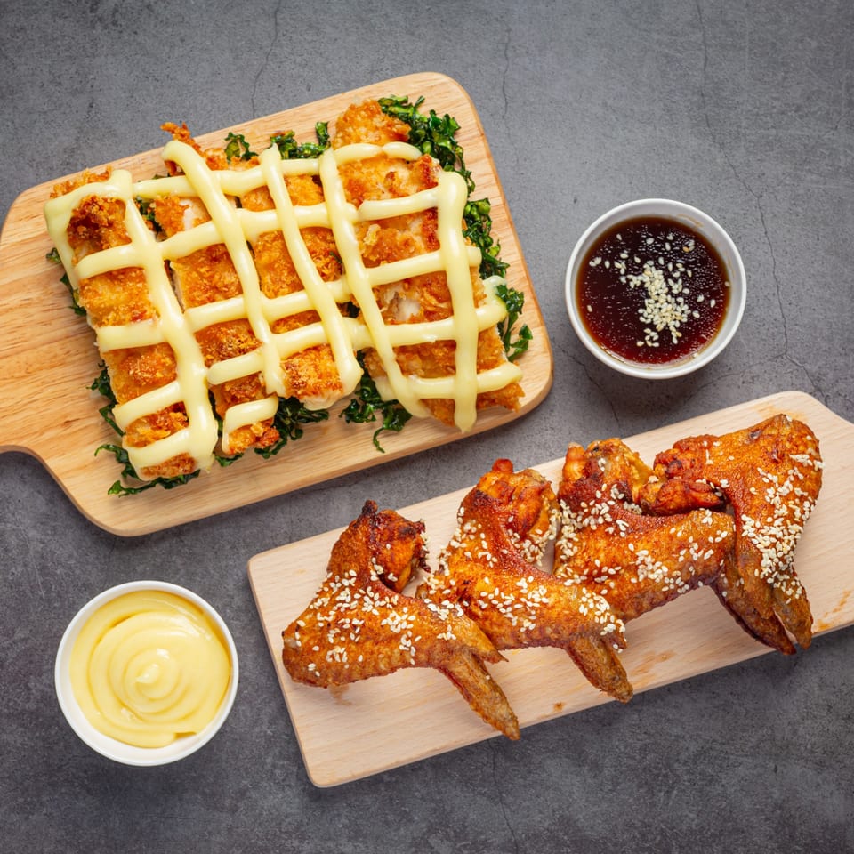 Ellenville Spice Fusion's fried chicken dishes, including crispy chicken with mayonnaise and sesame-crusted wings.